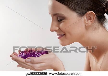 Woman smelling bath beads View Large Photo Image Stock Photography - Woman smelling bath beads. Fotosearch