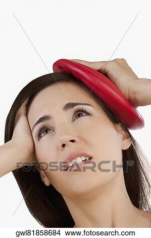 Woman suffering from a headache View Large Photo Image Picture - Woman suffering from a headache. Fotosearch