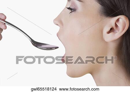Woman taking medicine View Large Photo Image Picture - Woman taking medicine. Fotosearch
