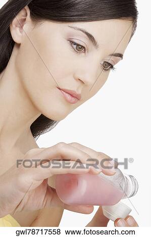 Stock Photo - Woman taking medicine. Fotosearch