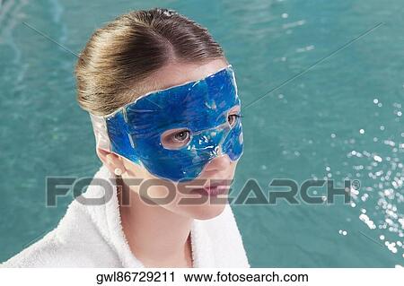 Woman wearing a mask at the poolside View Large Photo Image Stock Image - Woman wearing a mask at the poolside. Fotosearch