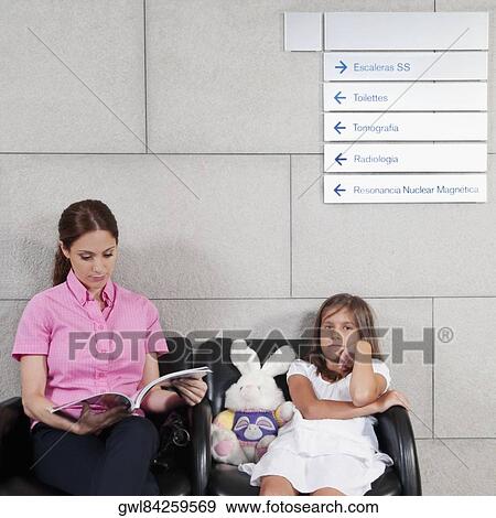 Woman with her daughter in a hospital waiting room View Large Photo Image Stock Photo - Woman with her daughter in a hospital waiting room. Fotosearch