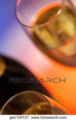 Close-up of a champagne bottle with two champagne flutes View Large Photo Image Stock Image - Close-up of a champagne bottle with two champagne flutes. Fotosearch