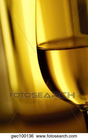 Close-up of a glass of wine View Large Photo Image Stock Photograph - Close-up of a glass of wine. Fotosearch