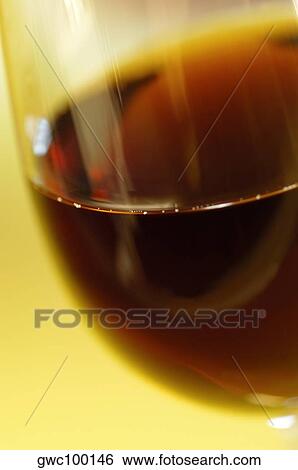 Close-up of a glass of wine View Large Photo Image Stock Photograph - Close-up of a glass of wine. Fotosearch