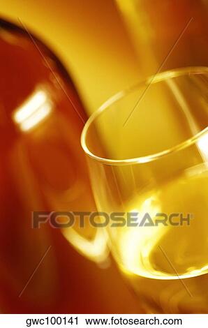 Close-up of a wine bottle with a glass of wine View Large Photo Image Stock Image - Close-up of a wine bottle with a glass of wine. Fotosearch