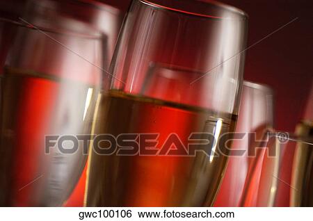 Close-up of champagne in champagne flutes View Large Photo Image Stock Photograph - Close-up of champagne in champagne flutes. Fotosearch