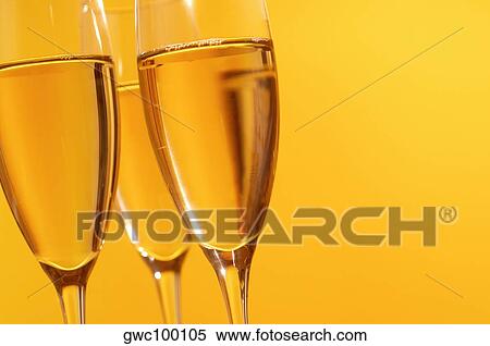 Close-up of champagne in three champagne flutes View Large Photo Image Stock Photography - Close-up of champagne in three champagne flutes. Fotosearch