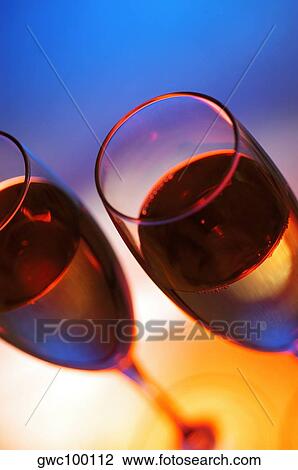 Close-up of champagne in two champagne flutes View Large Photo Image Stock Image - Close-up of champagne in two champagne flutes. Fotosearch