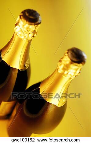 Close-up of two champagne bottles View Large Photo Image Stock Image - Close-up of two champagne bottles. Fotosearch