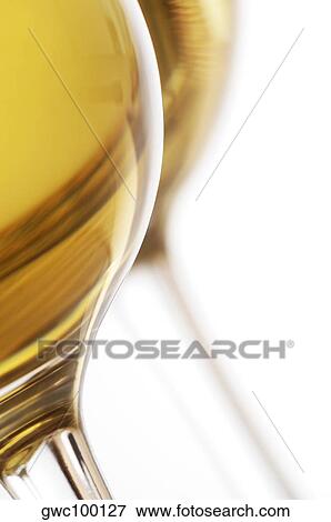 Close-up of two glasses of wine View Large Photo Image Stock Photo - Close-up of two glasses of wine. Fotosearch