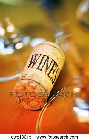 Stock Image - High angle view of a cork with wine glasses. Fotosearch