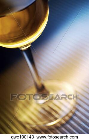 Stock Image - High angle view of a glass of wine. Fotosearch