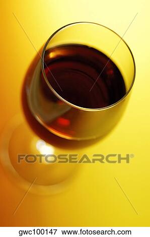 Stock Photo - High angle view of a glass of wine. Fotosearch