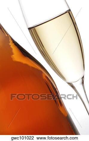 Close-up of a glass of wine with a wine bottle View Large Photo Image Stock Image - Close-up of a glass of wine with a wine bottle. Fotosearch