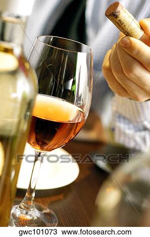 Close-up of a human hand holding a cork View Large Photo Image Stock Image - Close-up of a human hand holding a cork. Fotosearch