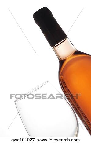 Stock Photo - Close-up of a wineglass and a wine bottle. Fotosearch
