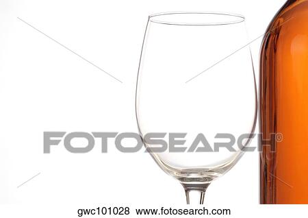Close-up of a wineglass and a wine bottle View Large Photo Image Stock Photo - Close-up of a wineglass and a wine bottle. Fotosearch