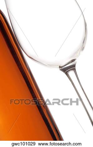 Close-up of a wineglass and a wine bottle View Large Photo Image Stock Photo - Close-up of a wineglass and a wine bottle. Fotosearch