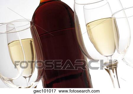 Close-up of champagne flutes and wine glasses with a wine bottle View Large Photo Image Stock Photo - Close-up of champagne flutes and wine glasses with a wine bottle. Fotosearch
