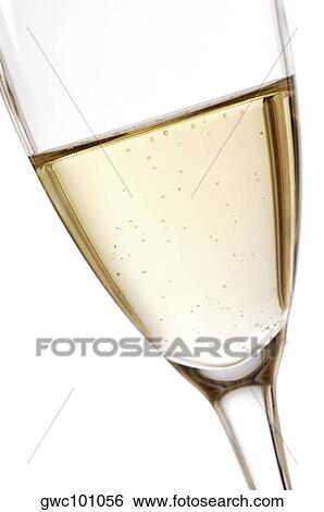 Close-up of champagne in a champagne flute View Large Photo Image Stock Photograph - Close-up of champagne in a champagne flute. Fotosearch