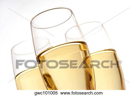 Close-up of champagne in three champagne flutes View Large Photo Image Stock Photography - Close-up of champagne in three champagne flutes. Fotosearch