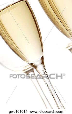 Picture - Close-up of champagne in two champagne flutes. Fotosearch