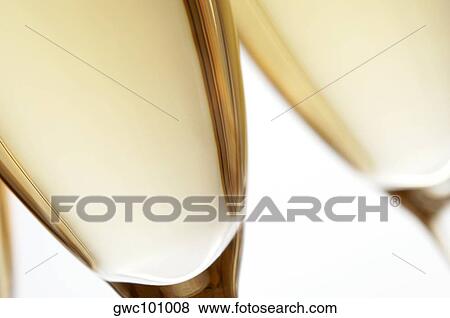 Close-up of champagne in two champagne flutes View Large Photo Image Stock Photo - Close-up of champagne in two champagne flutes. Fotosearch