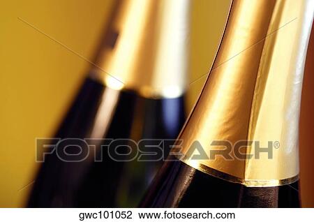 Close-up of two champagne bottles View Large Photo Image Stock Image - Close-up of two champagne bottles. Fotosearch