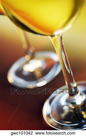 Close-up of two glasses of wine View Large Photo Image Stock Image - Close-up of two glasses of wine. Fotosearch