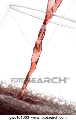 Close-up of wine being poured into a wineglass View Large Photo Image Stock Image - Close-up of wine being poured into a wineglass. Fotosearch