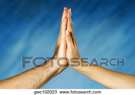 Stock Image - Close-up of a man and a woman's hands together. Fotosearch