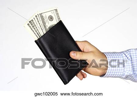 Stock Photography - Close-up of a person's hand holding a wallet. Fotosearch