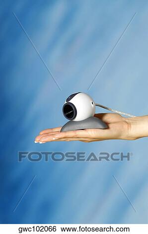 Close-up of a video conference camera on a woman's hand View Large Photo Image Stock Photograph - Close-up of a video conference camera on a woman's hand. Fotosearch
