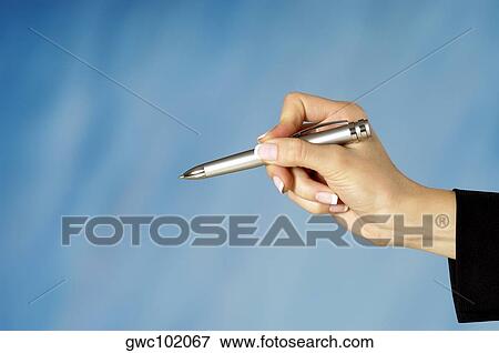 Stock Photo - Close-up of a woman's hand holding a pen. Fotosearch
