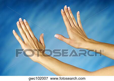 Stock Photo - Close-up of a woman's hands making a stop gesture. Fotosearch