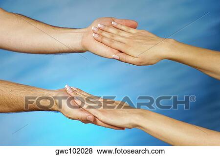 Stock Photo - Close-up of a woman's hands on a man's hands. Fotosearch