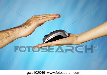 Computer mouse on a woman's hand with a man's hand above it View Large Photo Image Stock Photograph - Computer mouse on a woman's hand with a man's hand above it. Fotosearch