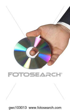 Stock Image - Close-up of a businessman holding a compact disk. Fotosearch