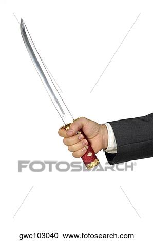 Close-up of a businessman holding a sword View Large Photo Image Stock Image - Close-up of a businessman holding a sword. Fotosearch