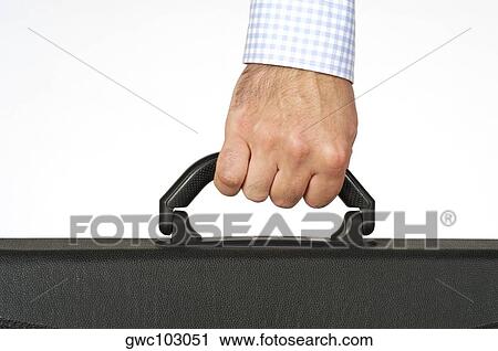 Stock Image - Close-up of a businessman holding a briefcase. Fotosearch