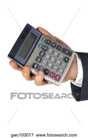 Stock Photo - Close-up of a businessman holding a calculator. Fotosearch