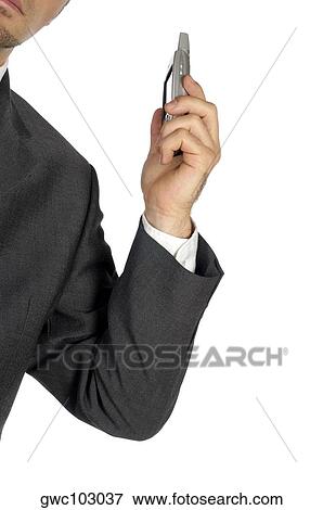 Stock Photo - Close-up of a businessman holding a personal data assistant. Fotosearch