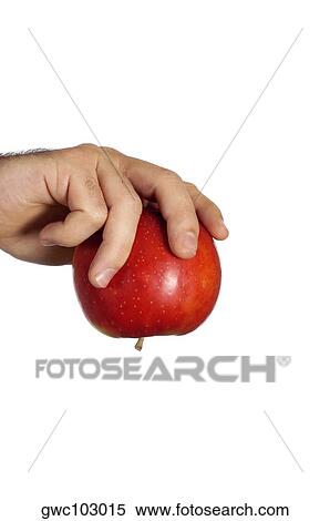 Stock Photography - Close-up of a businessman holding an apple. Fotosearch