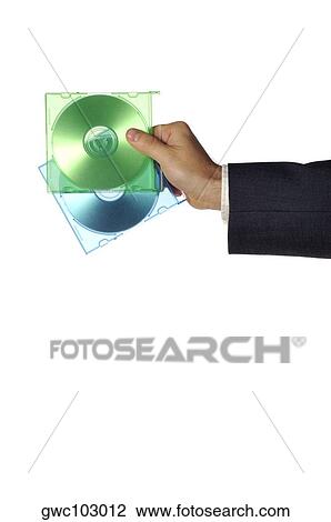 Close-up of a businessman holding two compact disks View Large Photo Image Stock Image - Close-up of a businessman holding two compact disks. Fotosearch