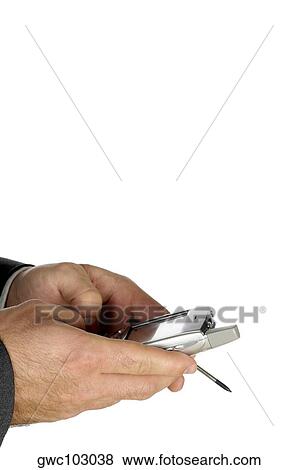 Stock Photo - Close-up of a businessman using a personal data assistant. Fotosearch