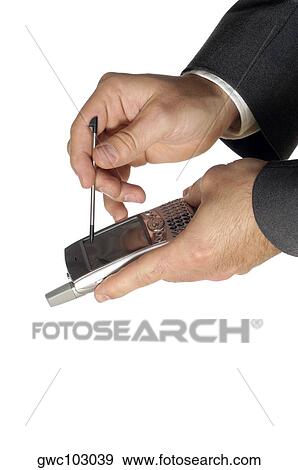 Close-up of a businessman using a personal data assistant View Large Photo Image Stock Photo - Close-up of a businessman using a personal data assistant. Fotosearch