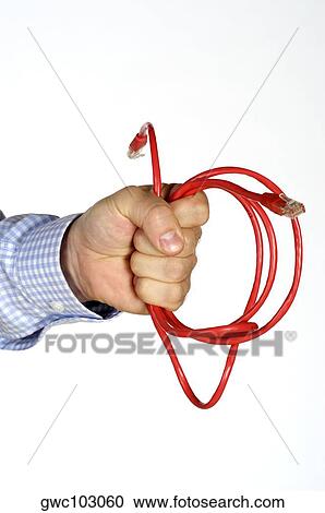Close-up of a person's hand holding a computer cable View Large Photo Image Stock Image - Close-up of a person's hand holding a computer cable. Fotosearch