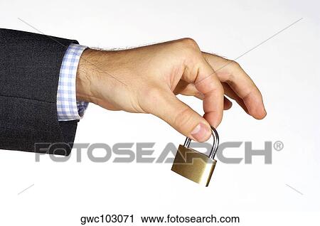 Close-up of a person's hand holding a padlock View Large Photo Image Stock Image - Close-up of a person's hand holding a padlock. Fotosearch