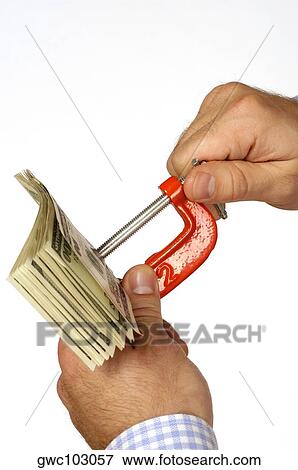 Close-up of a person's hand holding a vise grip with paper currency View Large Photo Image Stock Photo - Close-up of a person's hand holding a vise grip with paper currency. Fotosearch